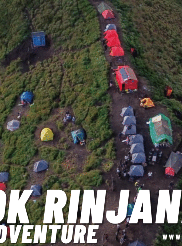 Aerial view of a crowded Rinjani campsite with multiple colored tents pitched on a grassy slope, showing a trail winding up the hill. The Lombok Rinjani Moment logo is overlaid.