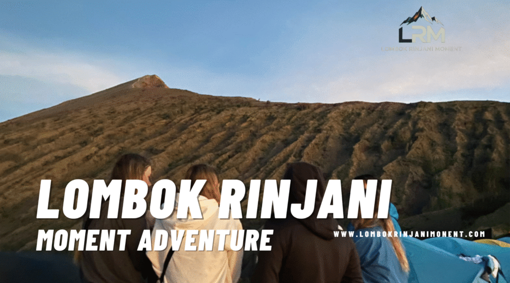Group of hikers looking up at the steep, scree-covered slope of the Rinjani summit at sunrise, ready for the final ascent.