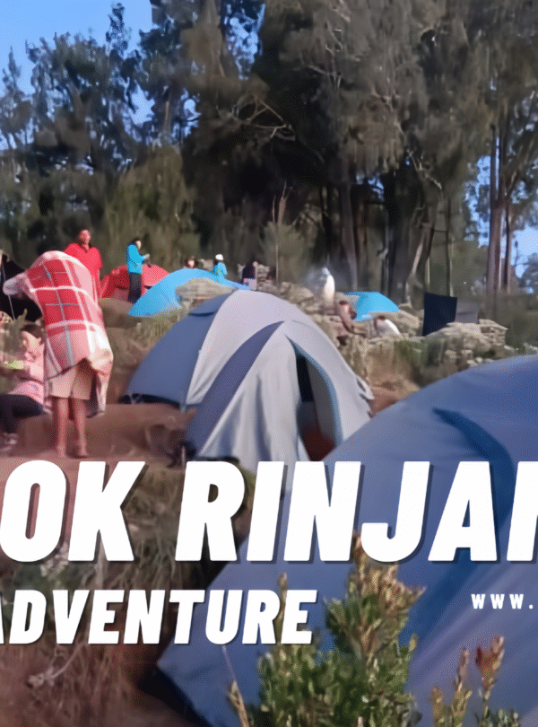 Young female hiker smiling brightly and wearing a cap and backpack on a sunny, grassy slope of Mount Rinjani.