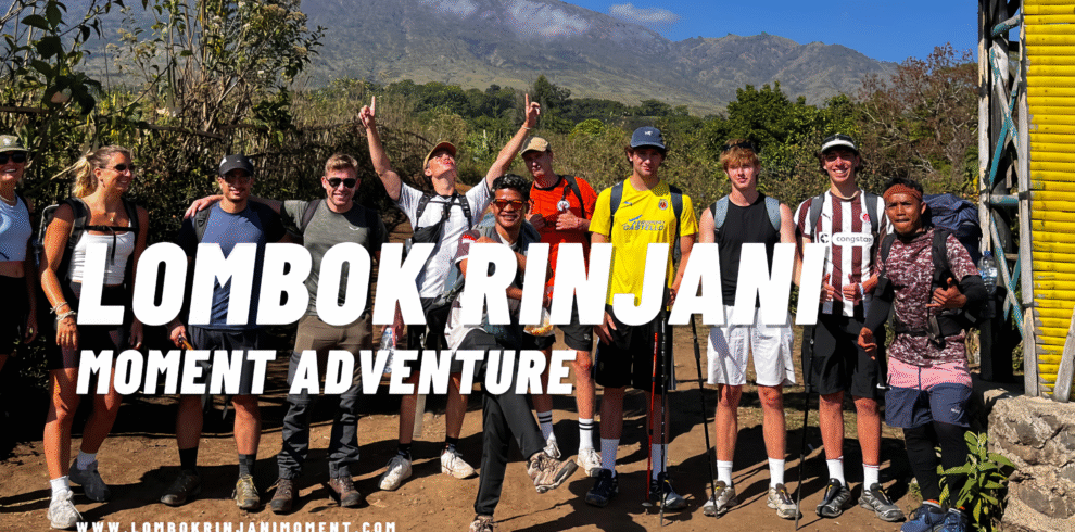 Group of hikers and colorful tents in a Rinjani campsite surrounded by scattered pine trees and dry grass during the evening.