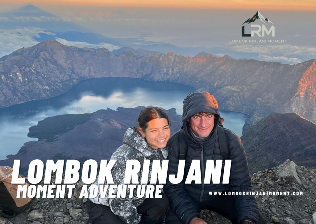 A smiling couple wearing warm jackets celebrating at the Mount Rinjani summit/crater rim, with the Segara Anak lake and caldera visible behind them during sunrise. The LRM Lombok Rinjani Moment logo is overlaid.