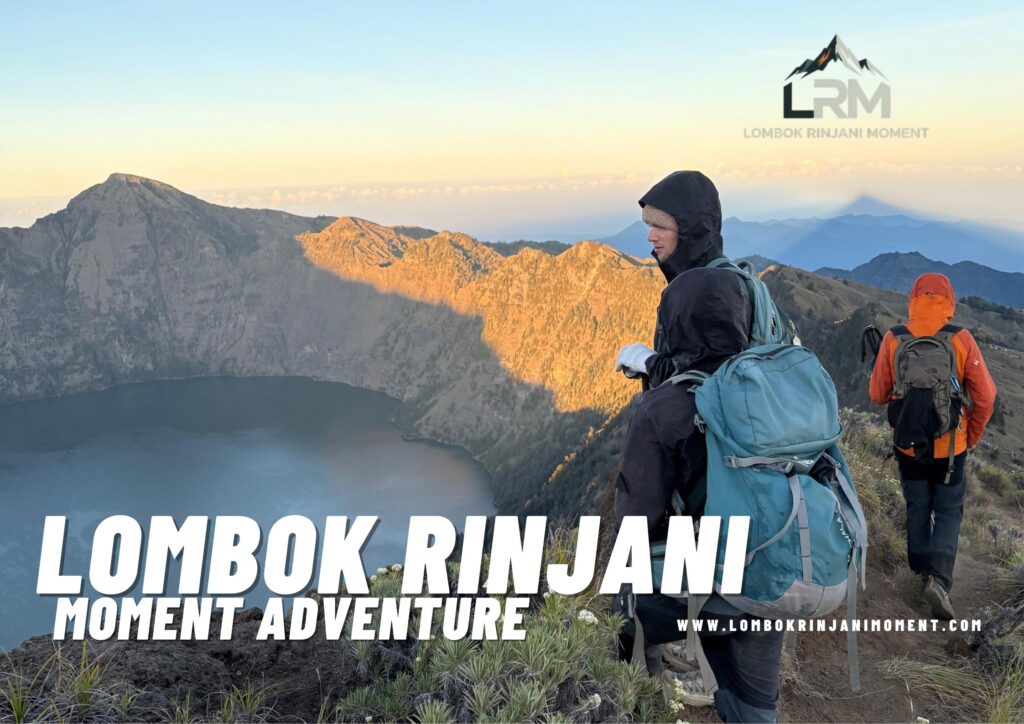 Two hikers, one with a blue backpack facing a stunning view of Mount Rinjani's caldera and Segara Anak lake during sunrise, with the Lombok Rinjani Moment logo overlay.