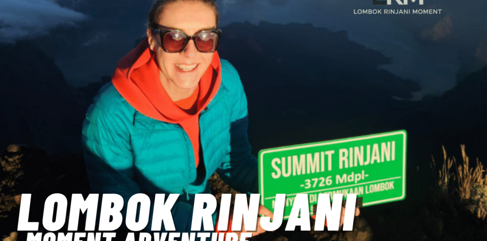 A happy female climber wearing sunglasses and a turquoise jacket holding a green "SUMMIT RINJANI - 3726 Mdpl" sign, with the LRM Lombok Rinjani Moment logo and text overlay. Majestic mountain range and clouds are visible in the background.