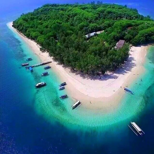 Lombok Snorkeling Tour Gili Nanggu featuring crystal clear turquoise water and vibrant coral reefs for a private underwater adventure.